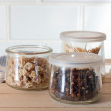 Clear, unlabeled Oui by Yoplait yogurt jars used to store ginger, peppercorns, and toothpicks.
